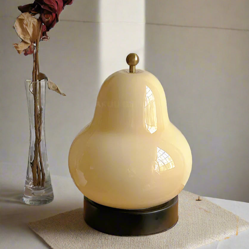 Yellow decorative lamp with dimensions on a table